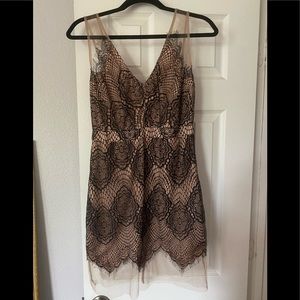 A. Peach lace & mesh cocktail dress.